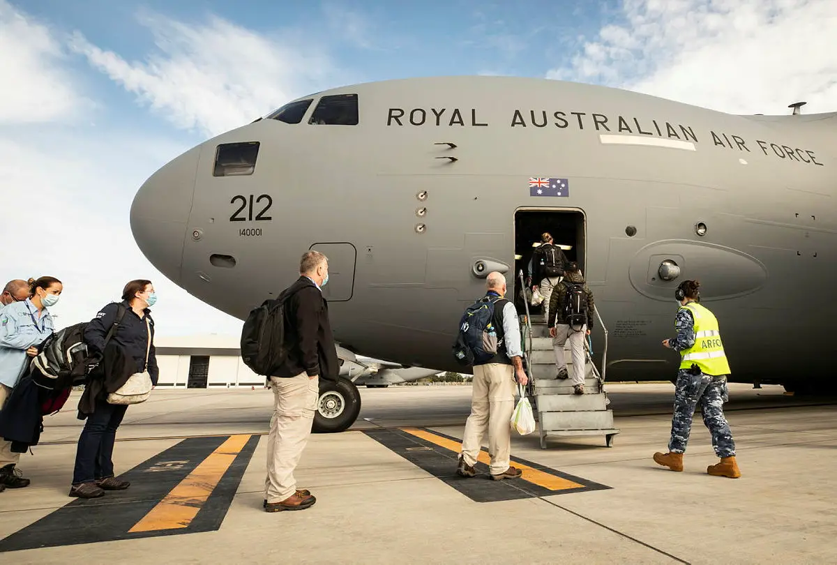 Australian Medical Assistance Team (AUSMAT) members board a No. 36 Squadron C-17A Globemaster III aircraft at RAAF Base Amberley, headed to Fiji in response to a COVID-19 outbreak across the nation.