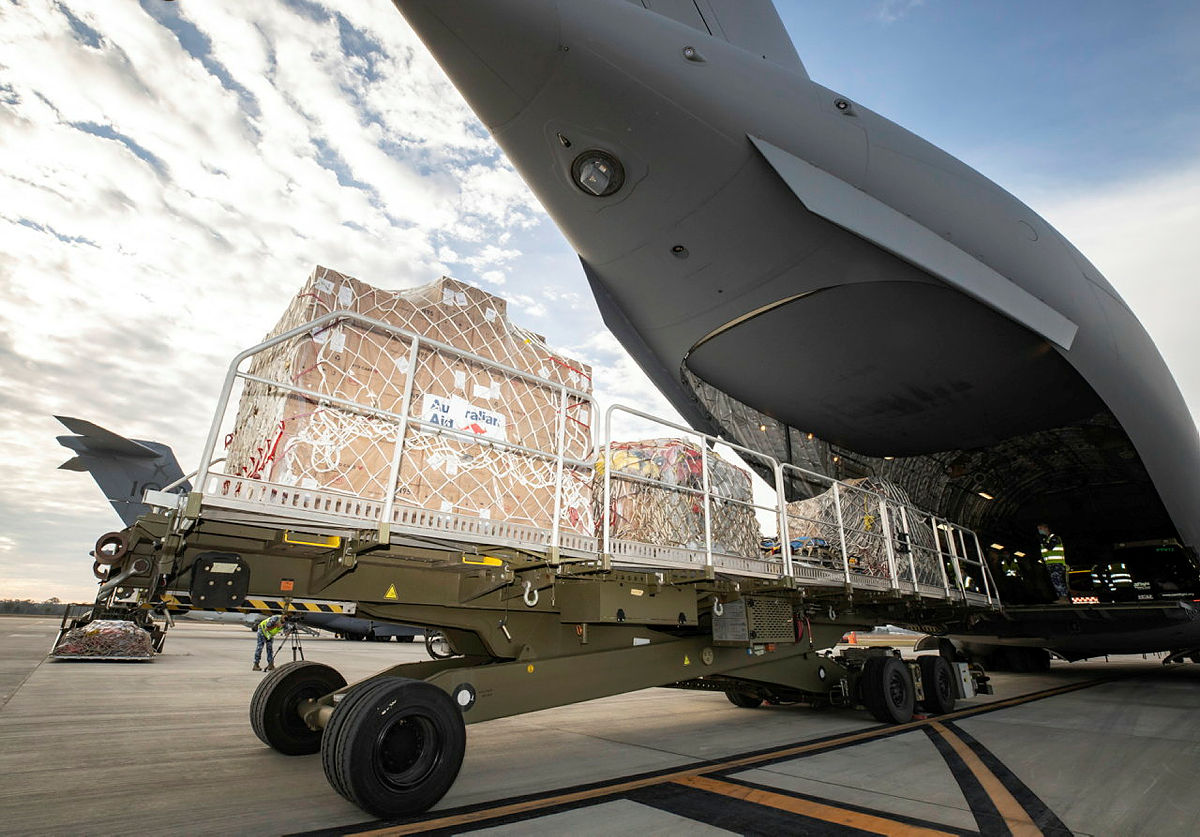 Humanitarian aid equipment is loaded into a No. 36 Squadron C-17A Globemaster III aircraft in order to be delivered to Fiji in response to a COVID-19 outbreak across the nation.