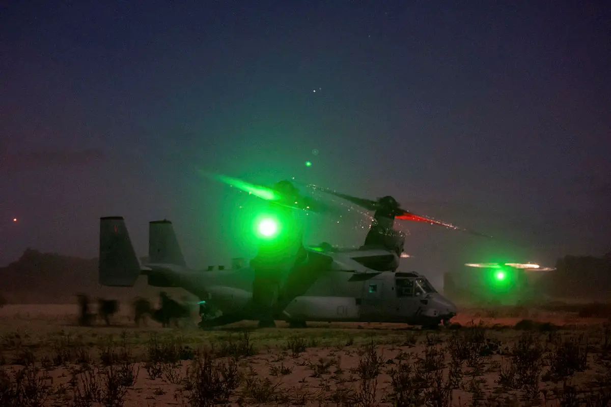 US Marines from 1st Battalion, 7th Marines, disembark a US MV-22B Osprey during an airfield assault serial near Bowen in Queesnland, on Exercise Talisman Sabre 2021.