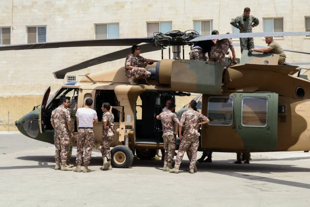 Soldiers of Bravo Company, 449th Aviation Support Battalion, Texas Army National Guard, and members of the Royal Jordanian air force inspect components of a UH-60M Black Hawk helicopter during joint training at a base outside of Amman, Jordan in July 2017. Jordan's most recent aircraft foreign military sales purchase â€“ a Black Hawk that will be upgraded to transport the royal family â€“ will complement Jordan existing Royal Squadron fleet of Black Hawks. (Army photo by Capt. Margaret Ziffer)