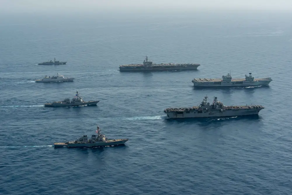 Ships of the UK Carrier Strike Group, USS Ronald Reagan Carrier Strike Group, and Iwo Jima Amphibious Ready Group operate in formation in the Gulf of Aden, July 12. UK, Dutch and U.S. naval forces conducted an integrated at-sea exercise designed to enhance maritime interoperability and demonstrate naval integration through a series of training scenarios.