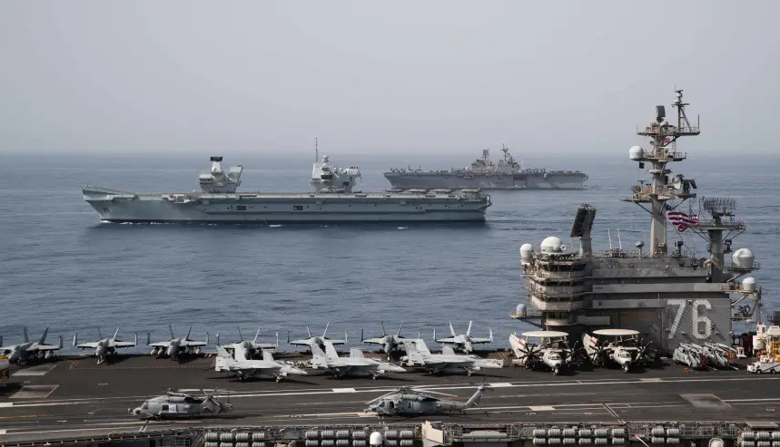 Ships of the UK Carrier Strike Group, USS Ronald Reagan Carrier Strike Group, and Iwo Jima Amphibious Ready Group operate in formation in the Gulf of Aden, July 12. 