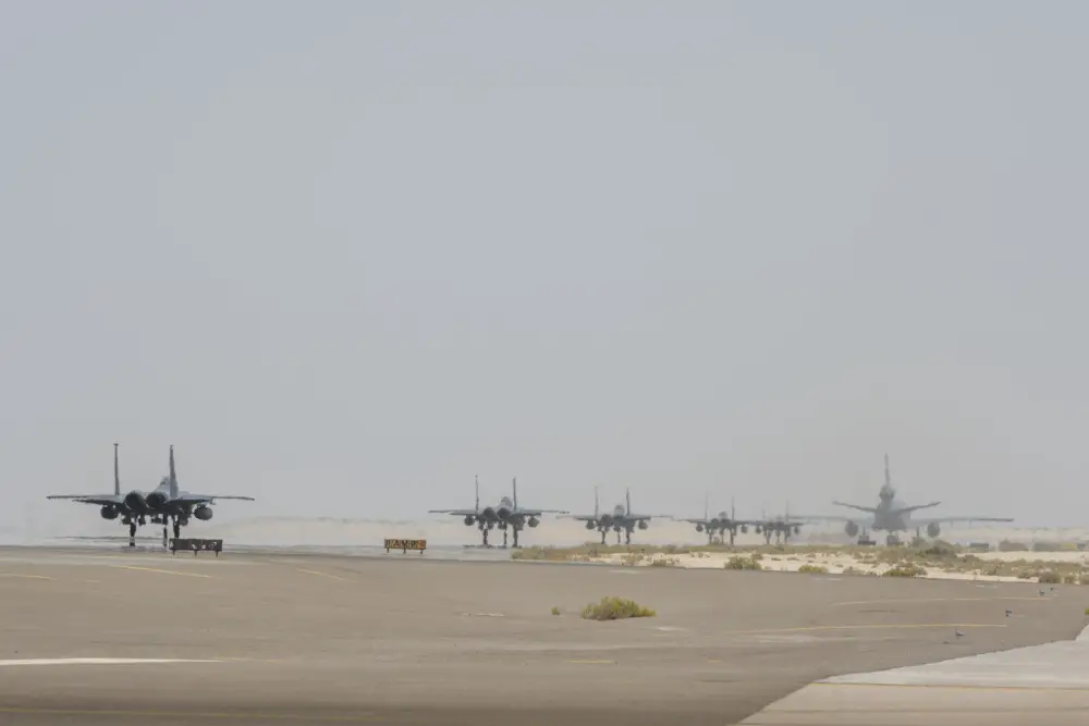 A KC-10 Extender from the 908th Expeditionary Air Refueling Squadron and several F-15E Strike Eagles assigned to the 494th Expeditionary Fighter Squadron prepare for takeoff July 5, 2021 from Al Dhafra Air Base, United Arab Emirates. 