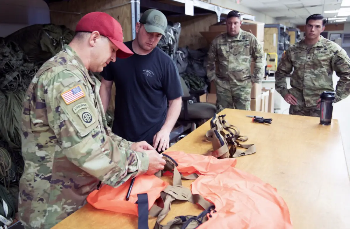 New Equipment Trainers from Fort Lee, Virginia instruct maintainers from across the airborne community on the proper maintenance and packing of the Parachutist Flotation Device (PFD).
