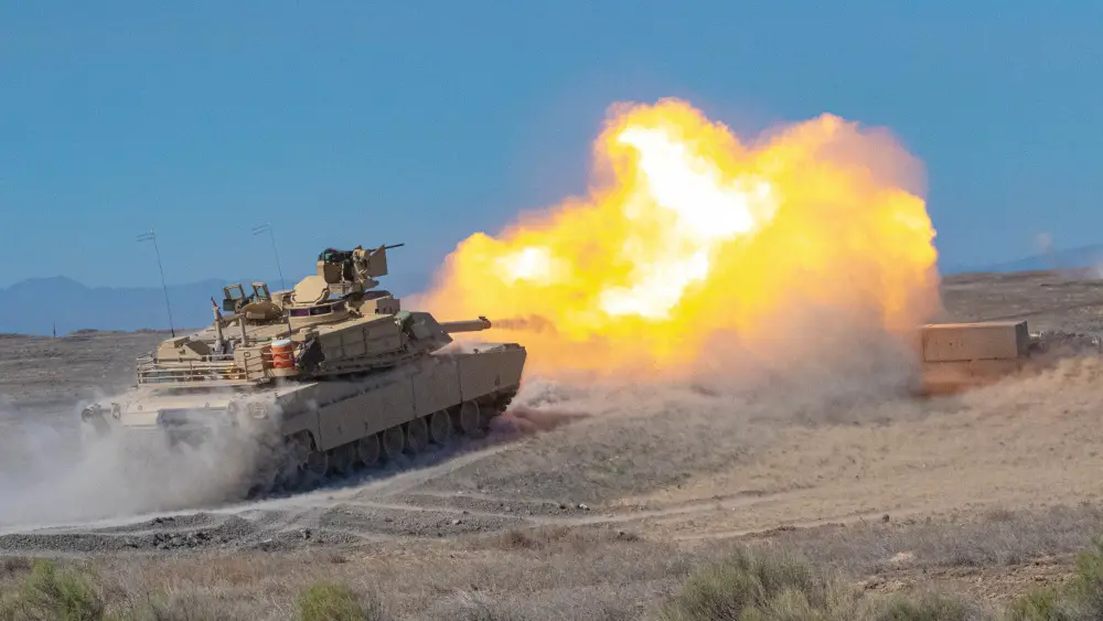 Oregon Army National Guard M1A2 Abrams battle tank with Alpha Troop, 3rd Squadron, 116th Cavalry Regiment, engages a target at a firing range during annual training at the Orchard Combat Tranining Center