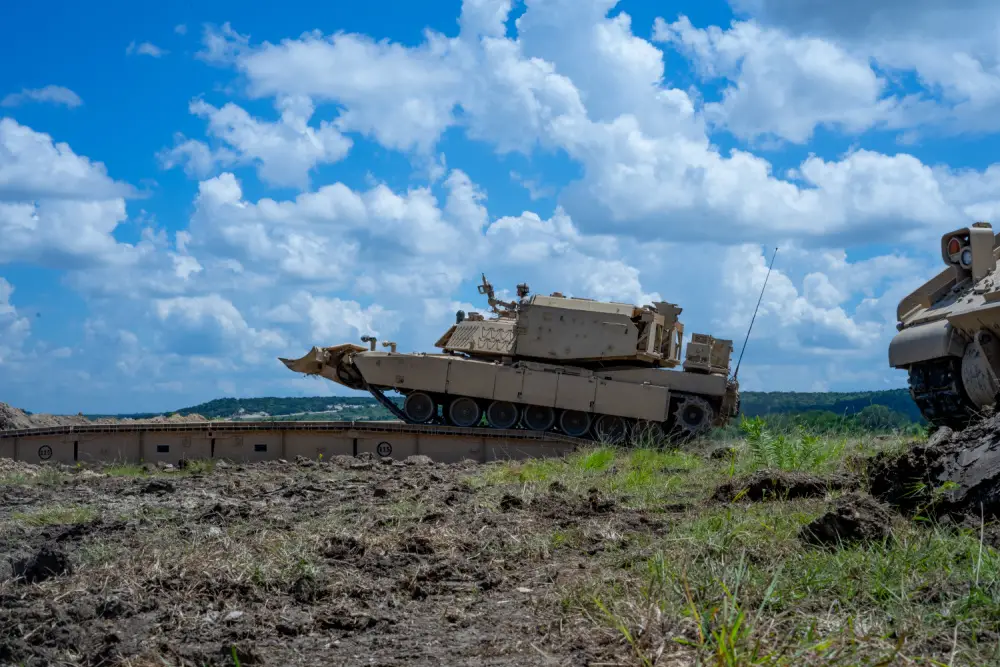 GREYWOLF Engineers with 3rd Brigade Engineer Battalion, 3rd Armored Brigade Combat Team, 1st Cavalry Division, roll across a Joint Assault Bridge (JAB) during a combined arms breach exercise, Fort Hood, Texas, June 6, 2021.