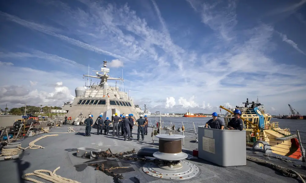 Sailors man their station on the fo'c'sle during a sea and anchor evolution aboard the Freedom-variant littoral combat ship USS Billings (LCS 15), as the ship departs for its maiden deployment, June 30, 2021. 