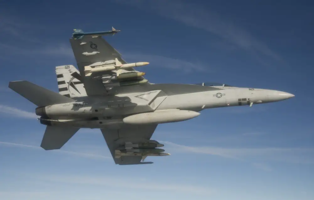 An F/A-18F Super Hornet assigned to the Salty Dogs of Air Test and Evaluation Squadron (VX) 23 conducts a captive carry flight test of an AGM-88E Advanced Anti-Radiation Guided Missile at Naval Air Station Patuxent River, Md.