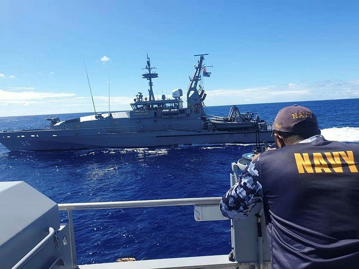 Royal Australian Navy Patrol Boat HMAS Glenelg conducts cooperative maritime surveillance activities with the Republic of Fiji Navy's Guardian Class Patrol Boat RFNS Savenaca