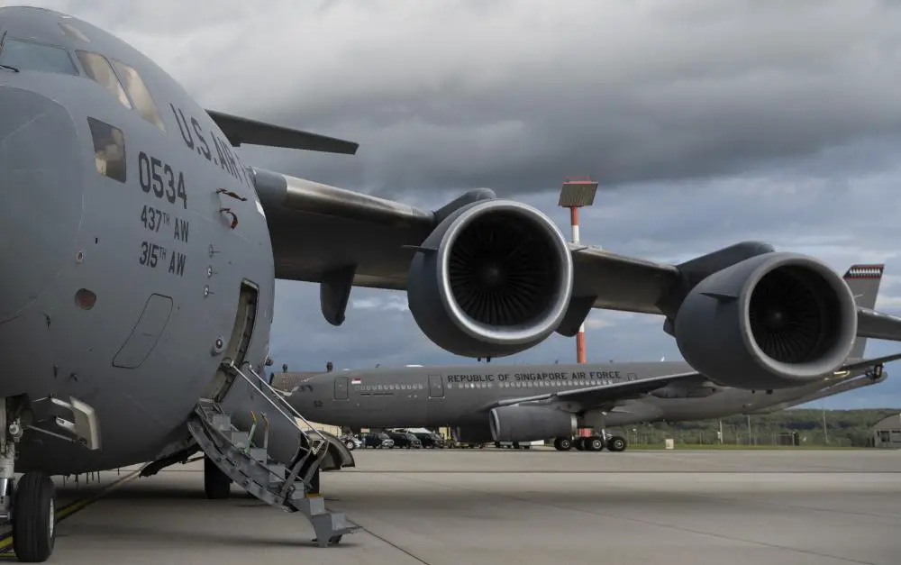 A Republic of Singapore Air Force A330 Multi-Role Tanker Transport aircraft taxis behind a U.S. Air Force C-17 Globemaster III cargo aircraft after landing on Spangdahlem Air Base, Germany, Aug. 27, 2021. The RSAF A330 multi-role tanker transport is equipped to provide aerial refuelling, transport and medical configuration capabilities. (U.S. Air Force photo by Tech. Sgt. Maeson L. Elleman)