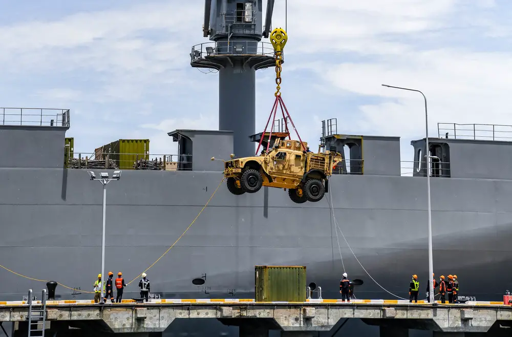 Thai and U.S. personnel work to offload a Joint Light Tactical Vehicle from the MV Cape Henry in support of Exercise Cobra Gold 21, at Toong Pronge Port in Chon Buri Province, Thailand, July 31, 2021. 