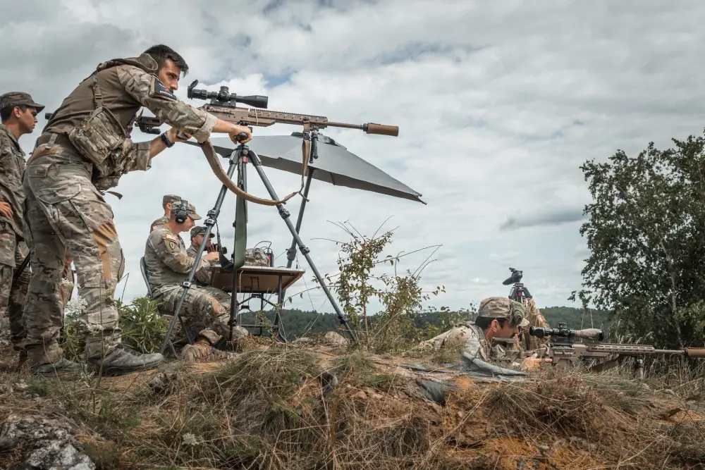 Greek soldiers search and engage targets during European Best Sniper Team Competition at Hohenfels, Germany, Aug. 11, 2021.