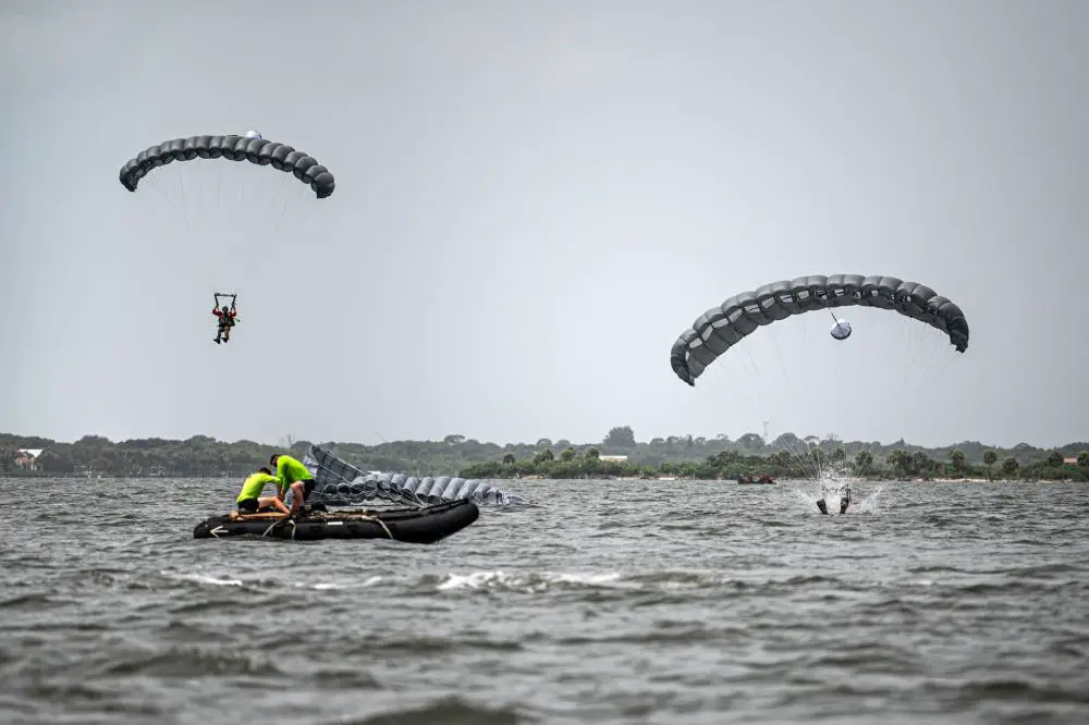 U.S. Air Force pararescuemen assigned to the 38th Rescue Squadron land in the Banana River during water jump training near Patrick Space Force Base, Florida, Aug. 24, 2021.