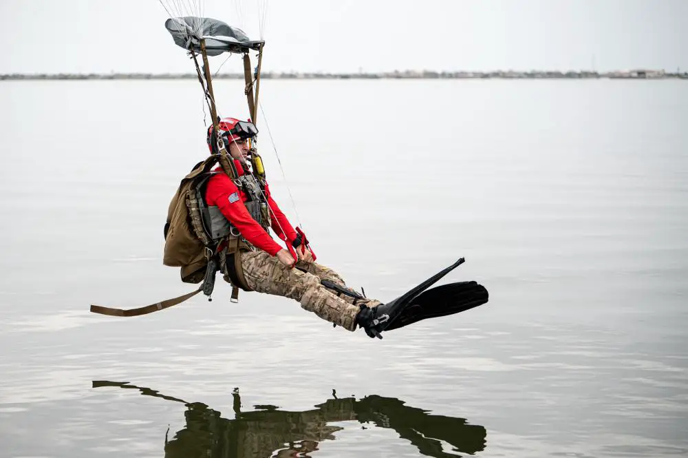 U.S. Air Force Tech. Sgt. Michael Galindo, 38th Rescue Squadron pararescueman Blue Team section chief, prepares to land in the Banana River during water jump training near Patrick Space Force Base, Florida, Aug. 24, 2021. 