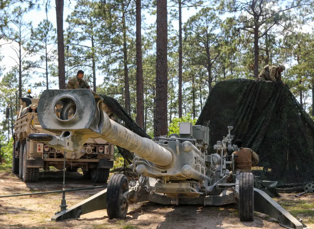 Soldiers with the Ohio Army National Guard’s 1st Battalion, 134th Field Artillery Regiment, 37th Infantry Brigade Combat Team create new cover and concealment for their M777 howitzer June 16, 2021, at the Joint Readiness Training Center in Fort Polk, La. 