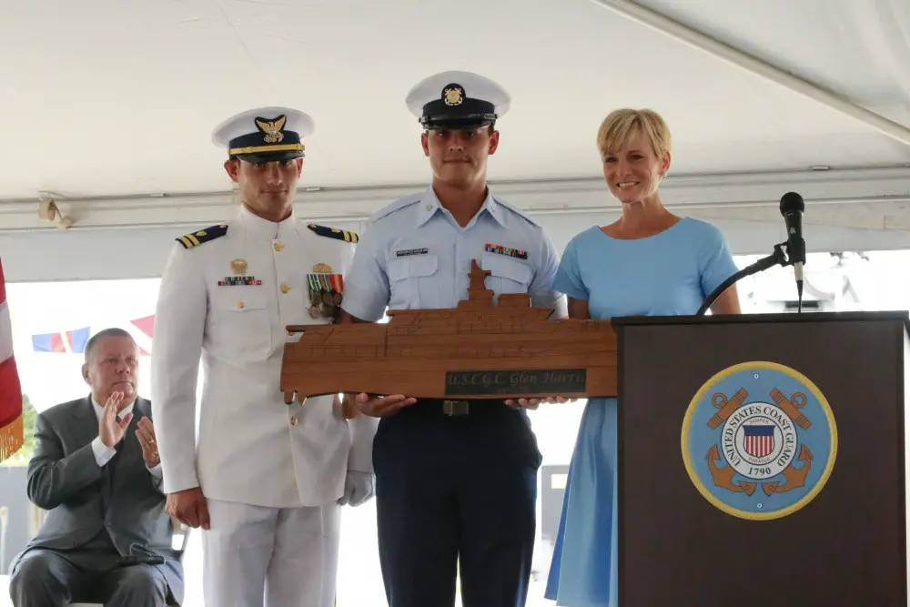 Lt. Reginald Reynolds, commanding officer of the Coast Guard Cutter Glen Harris, Petty Officer Third Class Kendrick Aguilar and Ms. Stacy Howley, the vessel's sponsor, pose for a photo during the vessel's commissioning ceremony at Coast Guard Sector Field Office Fort Macon in Beaufort, North Carolina, Aug. 6, 2021. 