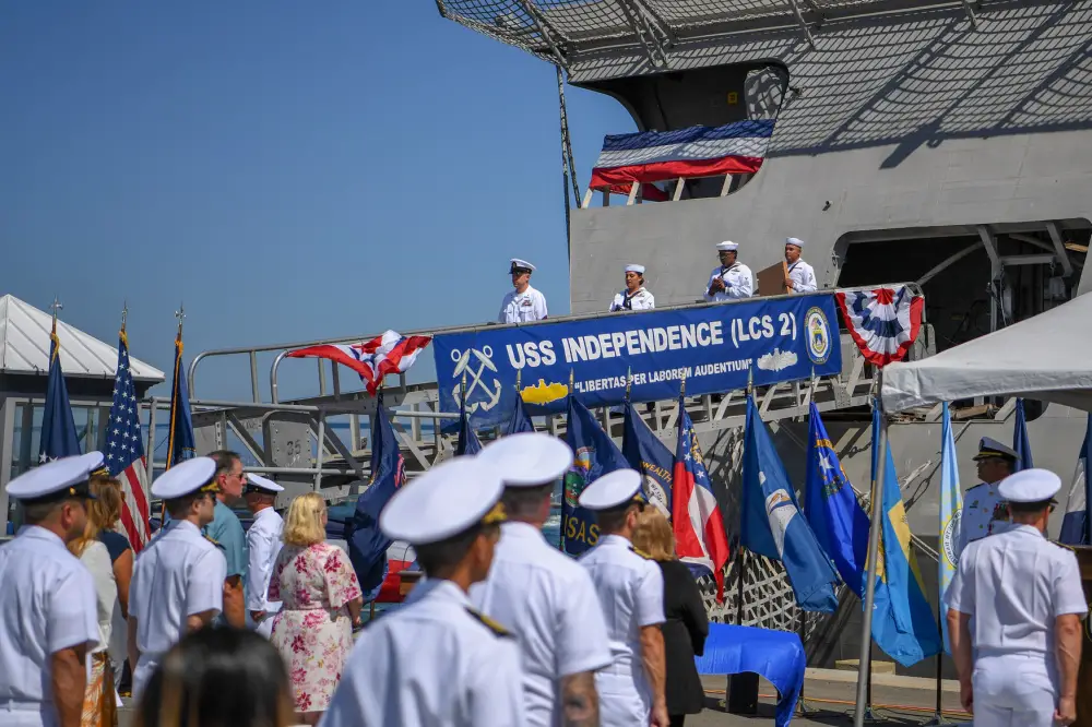 Ship's crew deliver the ensign and commissioning pennant during the decommissioning ceremony of littoral combat ship USS Independence (LCS 2). Independence was decommissioned after more than 10 years of distinguished service.