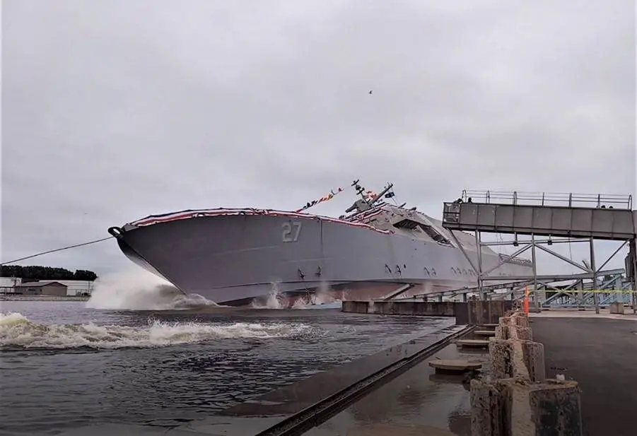 The 27th Littoral Combat Ship, the future USS Nantucket, launches sideways into the Menominee River in Marinette, Wisconsin, on August 7.