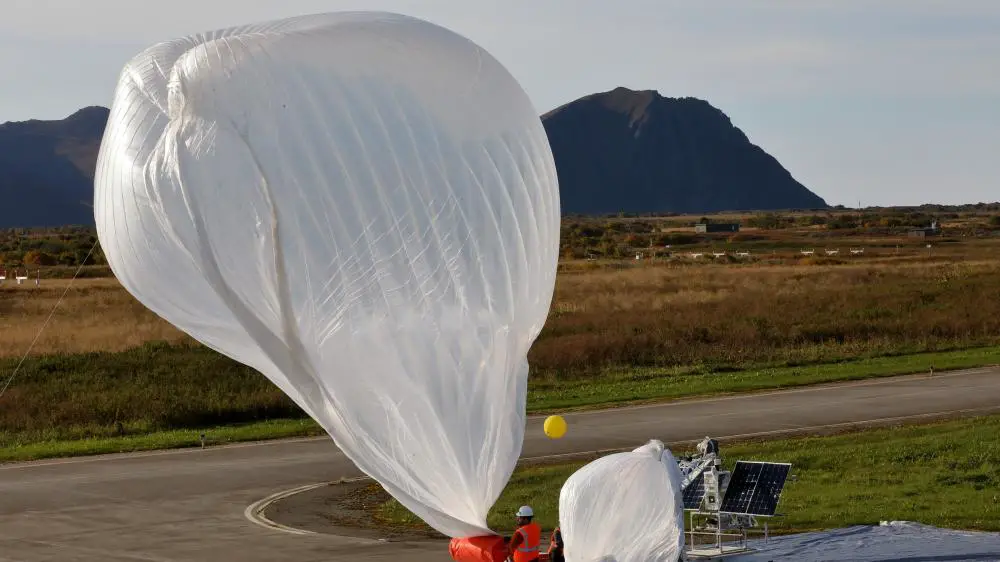 An electronics and engineering team from Raven Aerostar launches a high altitude balloon from Andoya Air Station to sense a simulated target in the Norwegian Sea during the Thunder Cloud live-fire exercise in Andoya, Norway, Sept. 15, 2021. Three high altitude balloons were launched into the stratosphere and relayed data to project coordinates for sensor to shooter fires.