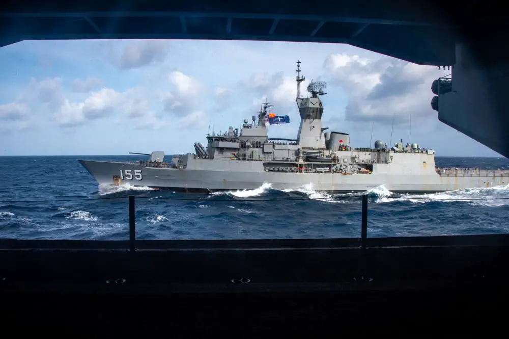  Royal Australian Navy Anzac-class frigate HMAS Ballarat (FFH 155) pulls alongside U.S. Navy Nimitz-class aircraft carrier USS Carl Vinson (CVN 70) to conduct a fueling-at-sea as part of Maritime Partnership Exercise (MPX) 2021, Oct. 16, 2021.