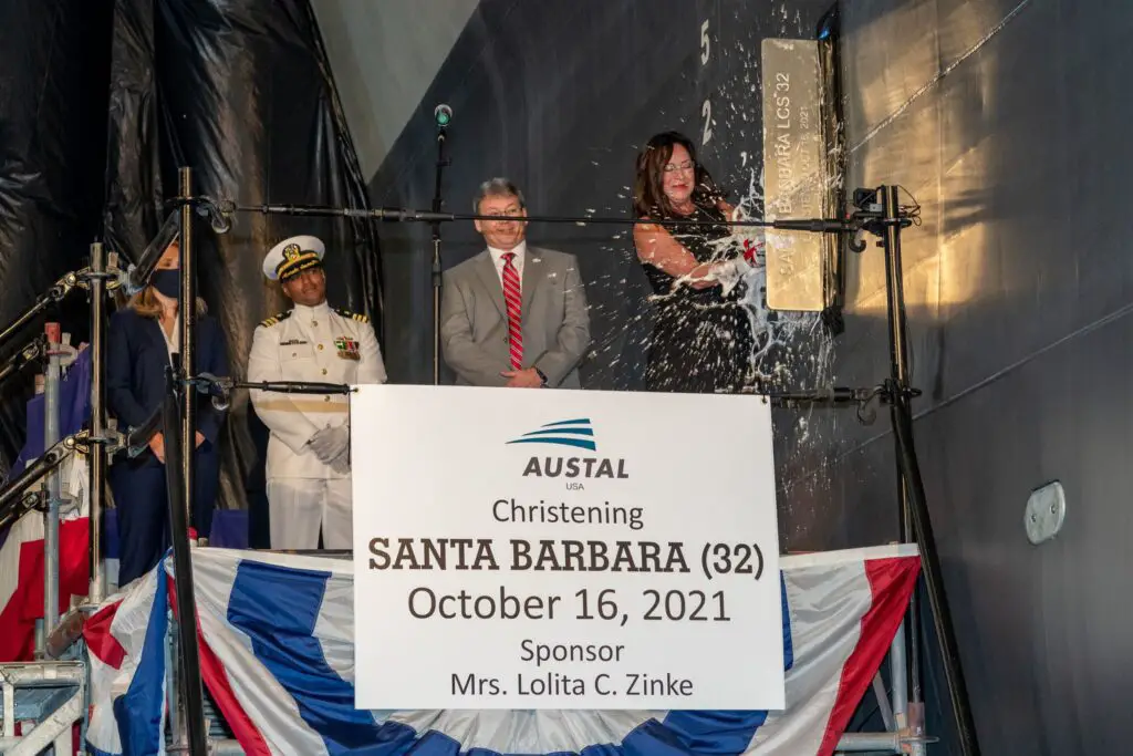 Ship sponsor Lolita Zinke christens the future USS Santa Barbara (LCS 32).