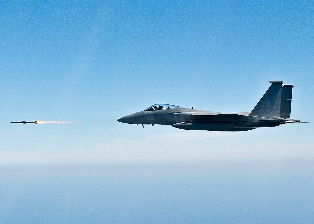 An F-15C Eagle from fires an AIM-120C AMRAAM missile
