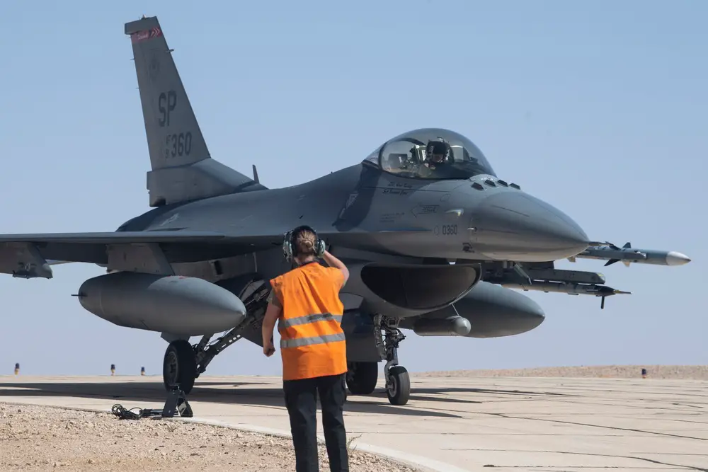 A U.S. Air Force crew chief from the 52nd Aircraft Maintenance Squadron marshals a U.S. Air Force F-16 Fighting Falcon fighter jet from the 480th Fighter Squadron during Blue Flag 21 at Uvda Air Force Base, Israel, Oct. 17, 2021.