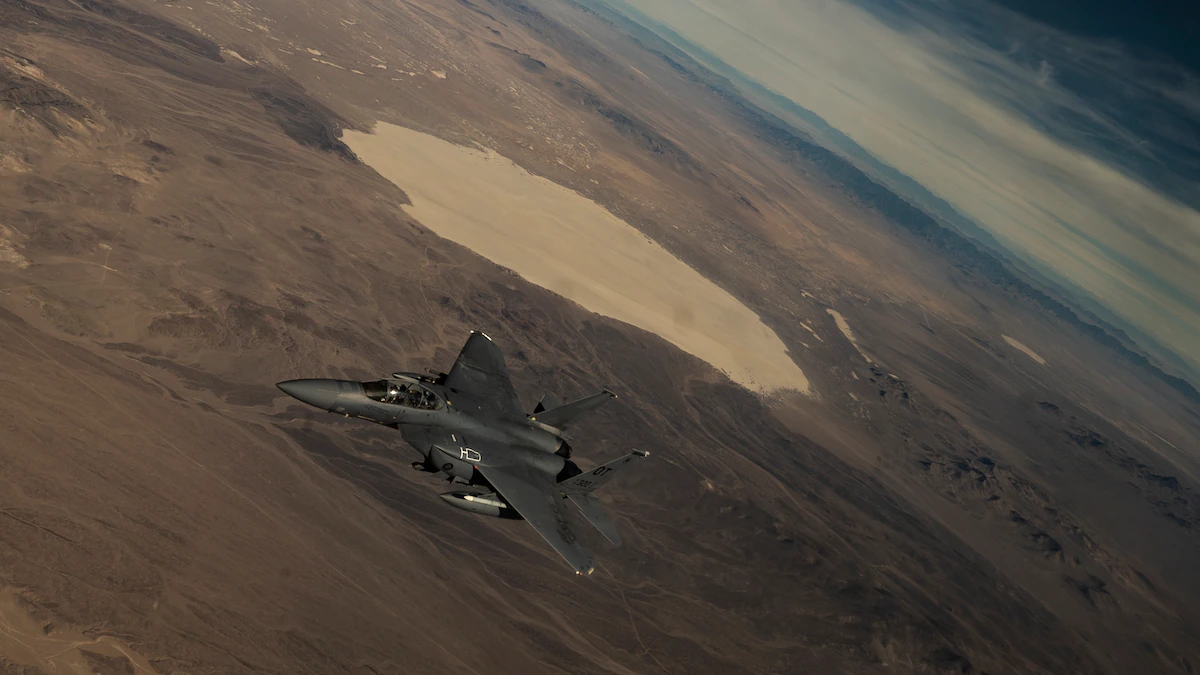 An F-15C Eagle flies over the Nevada Test and Training Range during its final defensive counter-air vul as part of Weapons School Integration 21-B at Nellis Air Force Base, Nevada, Dec. 8, 2021. As the Air Force continues to modernize, this class marks the final F-15C Weapons Instructor Course to be taught at the United States Air Force Weapons School.