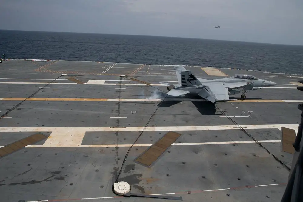  An F/A-18F Super Hornet assigned to Air Test and Evaluation Squadron (VX) 23 piloted by Lt. Cmdr. Jamie “Coach” Struck, performs an arrested landing aboard USS Gerald R. Ford (CVN 78) 