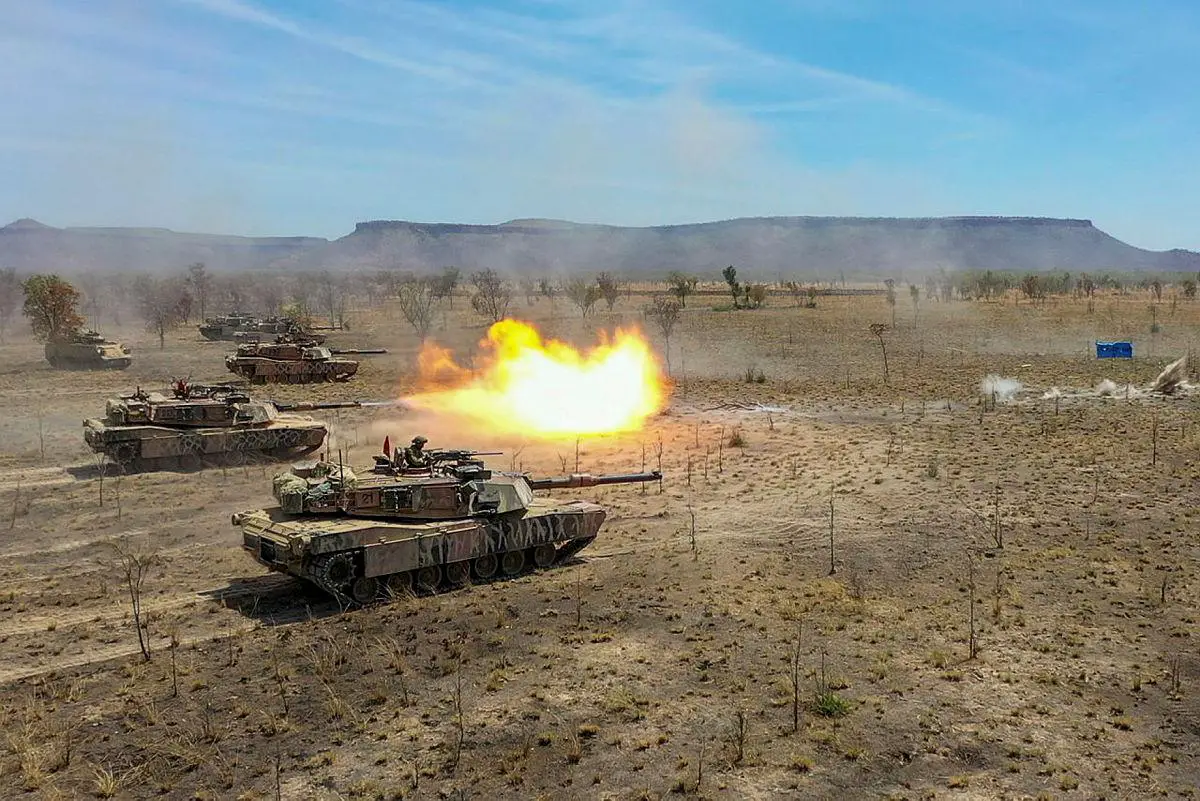Australian Army M1A1 Abrams Main Battle Tanks from the 1st Armoured Regiment live-fire their main armament during Exercise Koolendong 2021 at the Bradshaw Field Training Area, Northern Territory.