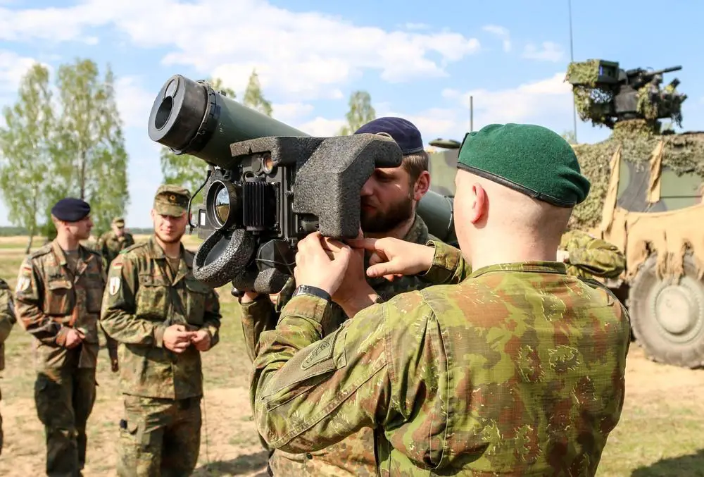 A Lithuanian Land Force Soldier teaches a Soldier with the German Army how to properly use a Javelin anti-tank guided missile during Exercise Hunter May 9, 2016, at General Silvestras Zukauskas Training Area in Pabrade, Lithuania. During the exercise, Soldiers from participating allied countries came together to learn the capabilities of each other’s anti-tank weapons systems.