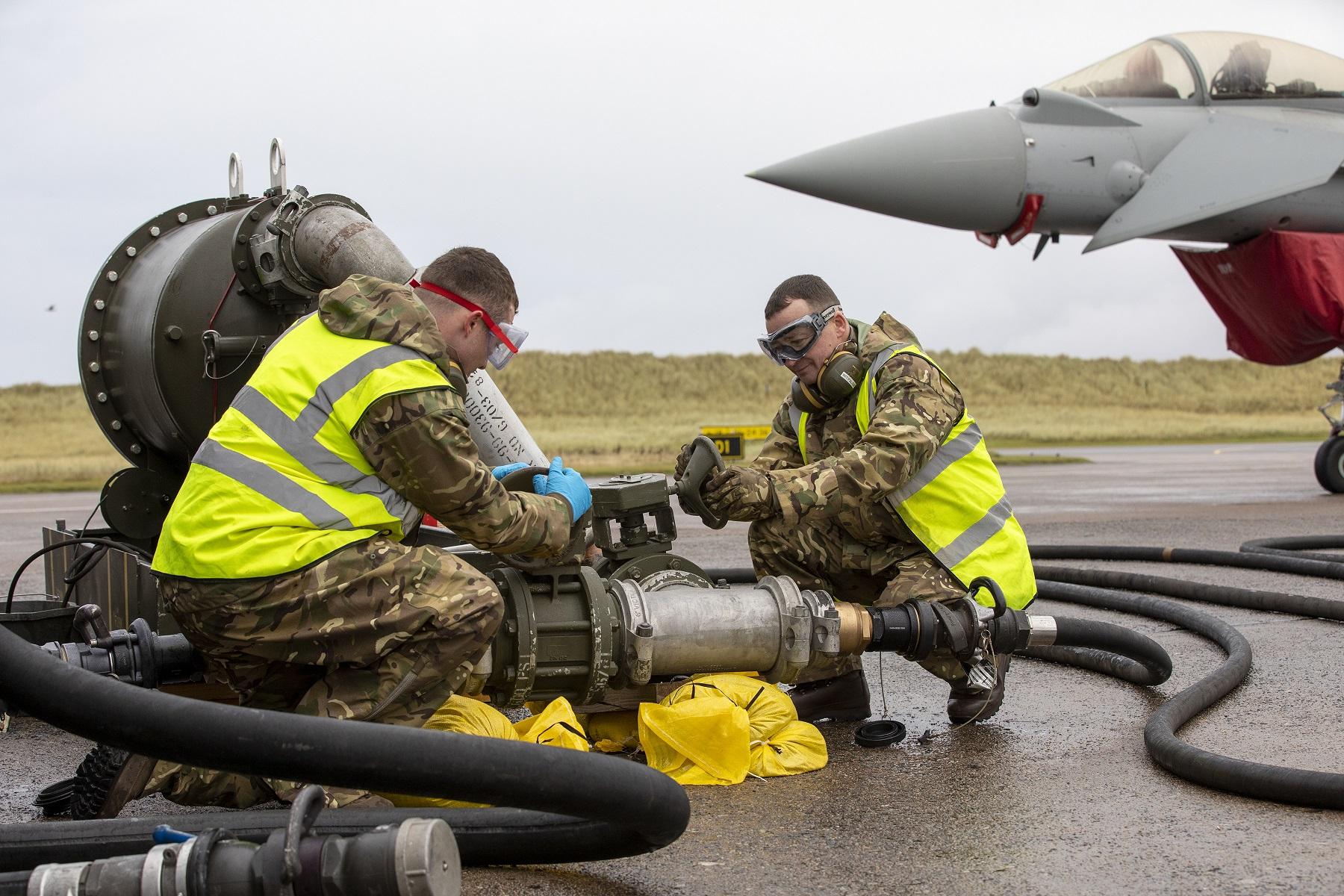 Royal Air Force personnel from 1 ELS setup and prepare to operate the filter water seperator.