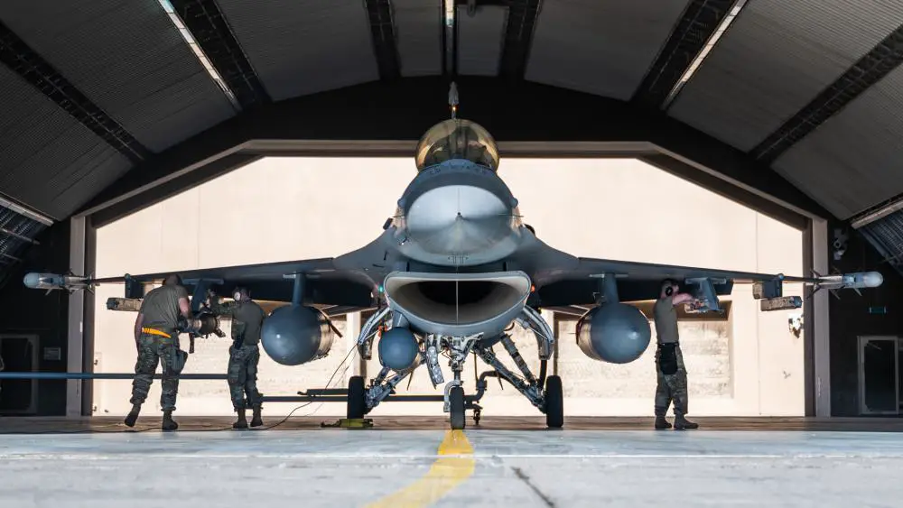 Airmen from the 378th Expeditionary Maintenance Squadron prepare to load munitions onto an F-16 Fighting Falcon at King Fahad Air Base, Kingdom of Saudi Arabia, Dec. 7, 2021. U.S. F-16s integrated with Royal Saudi Air Force F-15s to strengthen and reinforce air defenses against any potential threats.