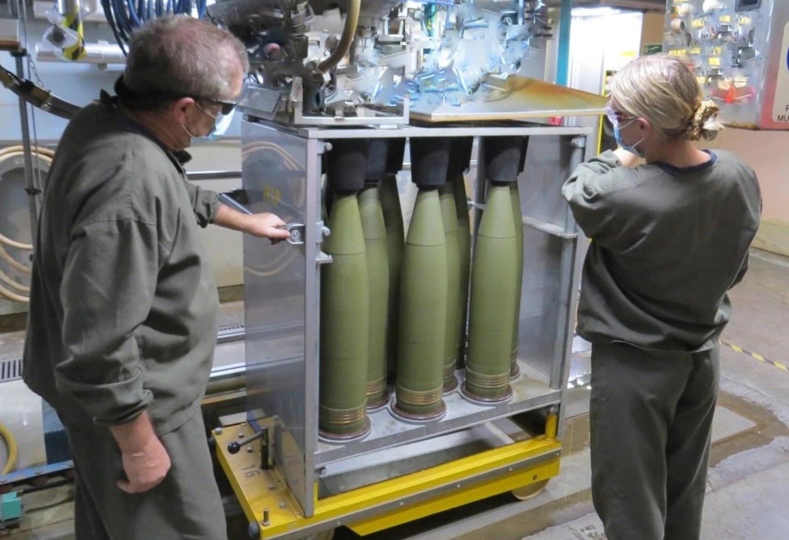 Thales Australia employees fill M795 155mm high-explosive projectiles at the Benalla Munitions Manufacturing Plant in Victoria, Australia.
