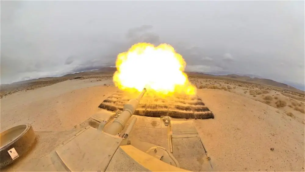 An M1A2 Abrams SEP V2 main battle tank, assigned to Cold Steel Troop, 1st Squadron, 11th Armored Cavalry Regiment, fires a M865 target practice cone stabilized discarding sabot with tracer on December 9, 2021, at the National Training Center and Fort Irwin training area.