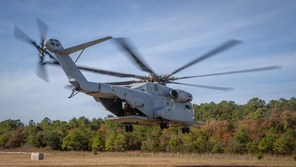 U.S. Marines with 2d Battalion, 2d Marine Regiment, 2d Marine Division, move from their security position during an operational evaluation of the CH-53K King Stallion at Camp Lejeune, N.C., Nov. 21, 2021.