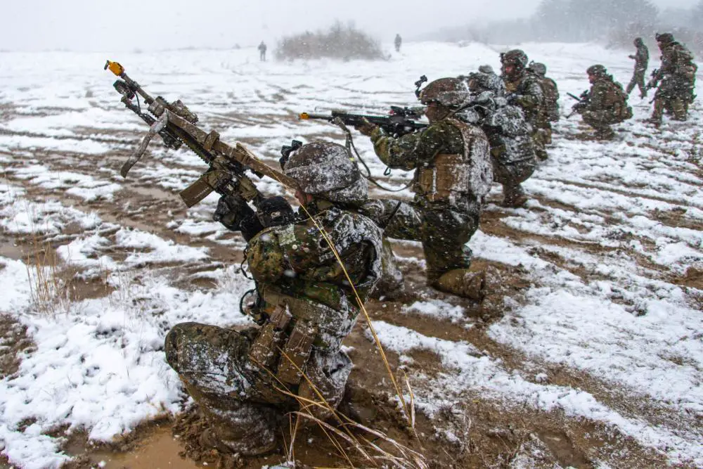 U.S. Marines with 2d Battalion, 7th Marines fire at opposing forces while conducting a force-on-force exercise during Resolute Dragon 21 on Ojojihara Proving Grounds, Japan, Dec. 13, 2021. 