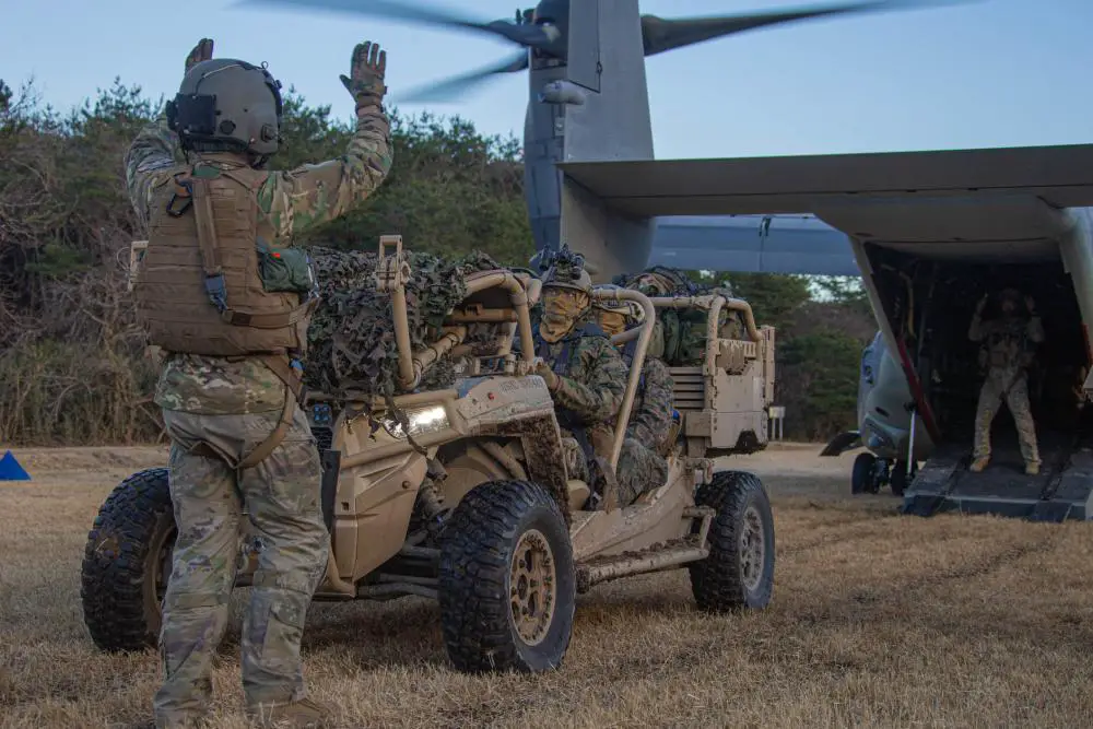 U.S. Marines with 3d Reconnaissance Battalion, 3d Marine Division, load a Utility Task Vehicle onto a U.S. Air Force CV-22 Osprey while conducting an aerial insertion during Resolute Dragon 21 on Ojojihara Proving Grounds, Dec. 11, 2021.
