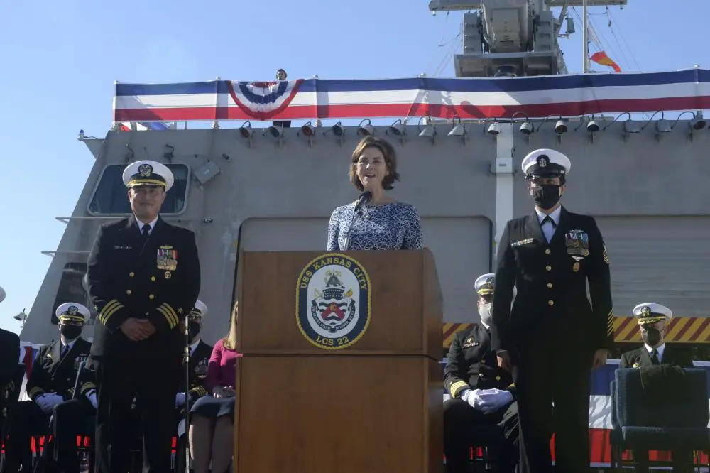 NAVAL BASE SAN DIEGO Tracy Davidson, the ship sponsor of Independence-variant littoral combat ship USS Kansas City (LCS 22) delivers the order to man the ship and bring her to life during a commissioning commemoration ceremony on the flight deck.
