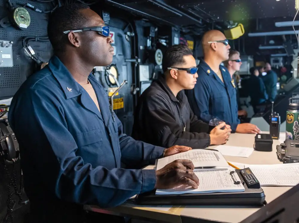  Sailors aboard Amphibious transport dock ship USS Portland (LPD 27) observe a high-energy laser weapon system demonstration on a static surface training target, Dec. 14, while sailing in the Gulf of Aden. 