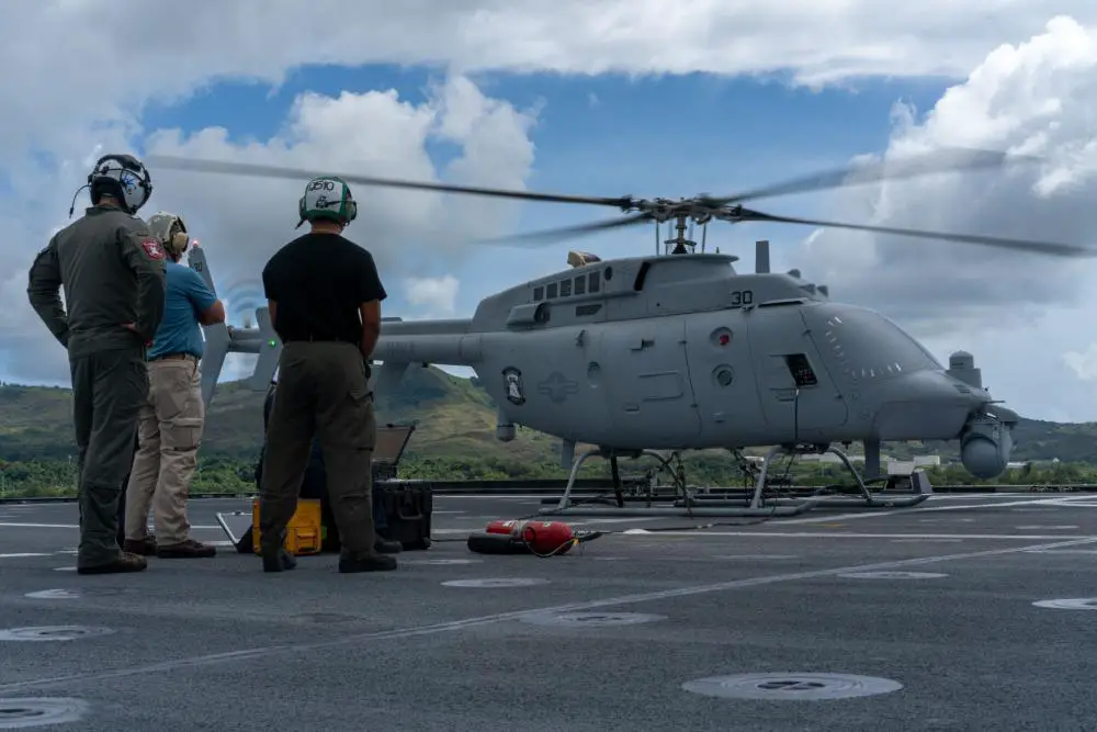  Sailors attached to Helicopter Sea Combat Squadron (HSC) 23, assigned to the Independence-variant littoral combat ship USS Jackson (LCS 6) and Naval Engineering Technology (NET) technicians perform ground turns on an MQ-8C Fire Scout on the flight deck of Jackson. 