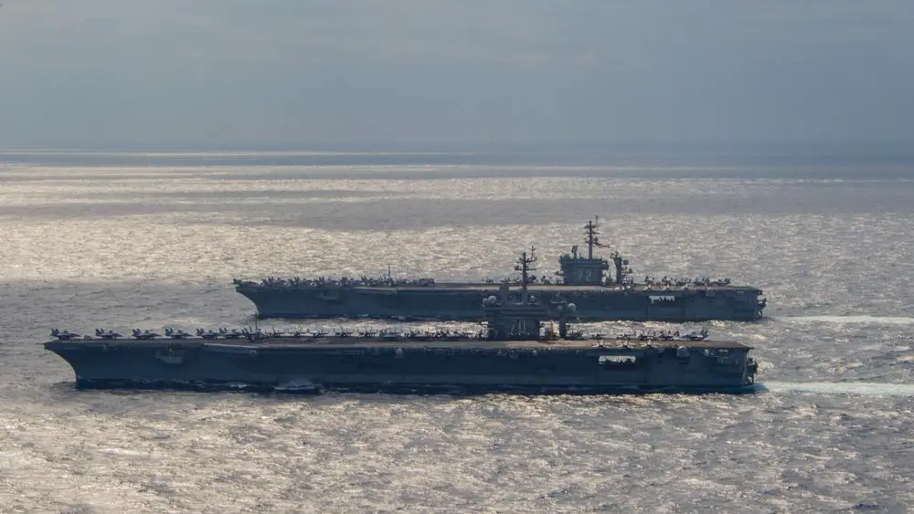 Nimitz-class aircraft carriers USS Carl Vinson (CVN 70) and USS Abraham Lincoln (CVN 72) transit the Philippine Sea, Jan. 22, 2022. width=