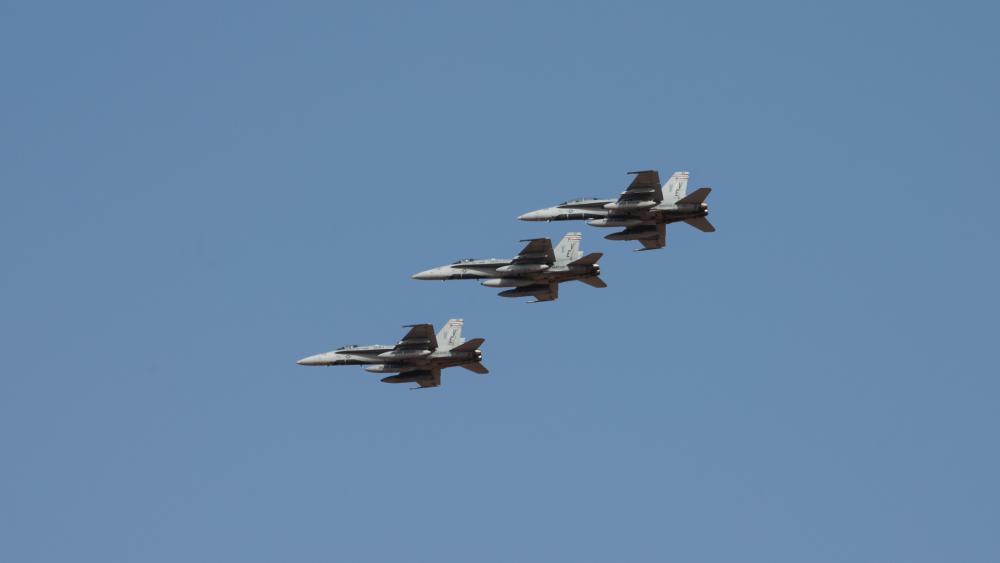 U.S. Marine F/A-18 Hornets from the Marine Fighter Attack Squadron 115 fly over Prince Sultan Air Base, Kingdom of Saudi Arabia, Dec. 23, 2021. The arrival of the Marine Fighter Attack Squadron 115 improves the ability of the Combined Forces Air Component Commander to move forces fluidly across the theatre. (U.S. Air Force photo by Senior Airman Jacob B. Wrightsman)