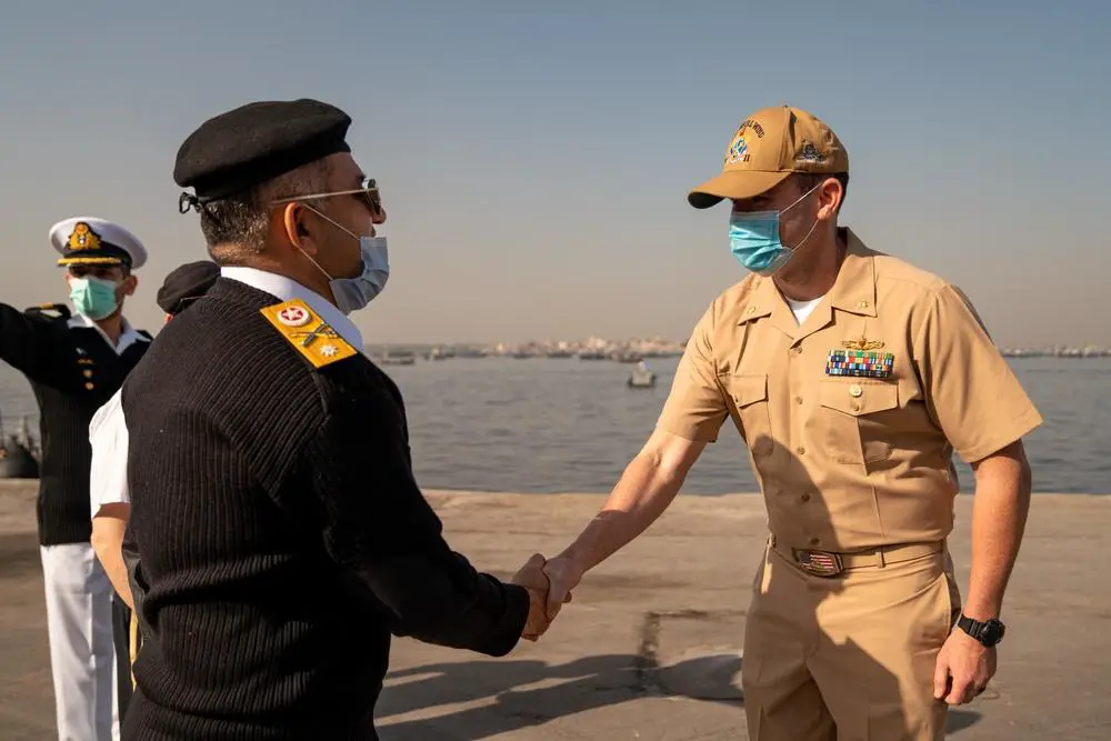 Lt. Cmdr. Martin Dineen, commanding officer of USS Whirlwind (PC 11), greets a Pakistani officer after arriving in Karachi, Pakistan, for a scheduled port visit Jan. 25. Whirlwind is currently operating in the Middle East region to help ensure maritime security and stability. 