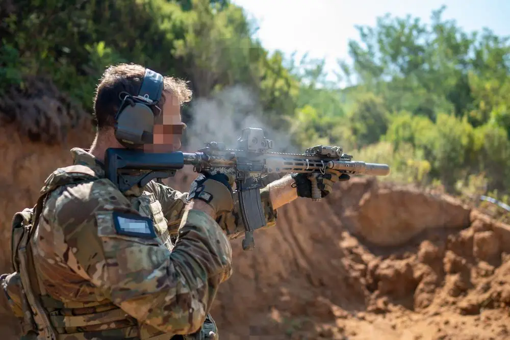 A U.S. Army Green Beret assigned to 10th Special Forces Group conducts live fire training on a small arms training range, Albania.