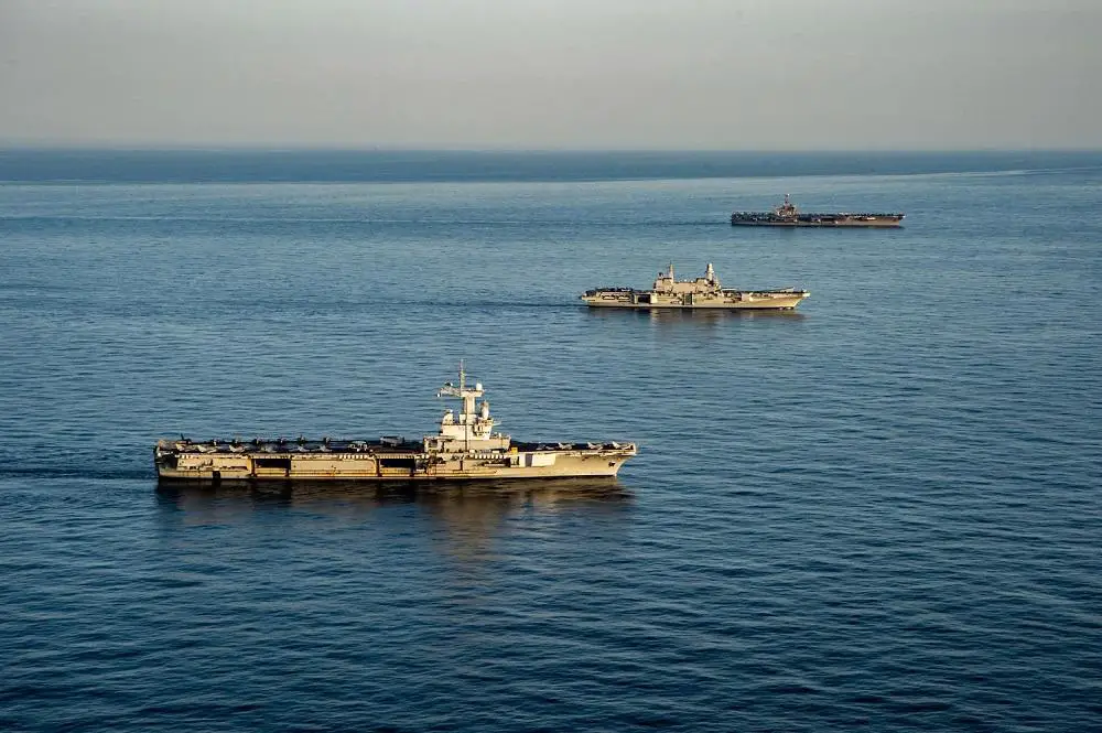 From right to left, Nimitz-class aircraft carrier USS Harry S. Truman (CVN 75), the Italian aircraft carrier ITS Cavour (C 550) and the French aircraft carrier Charles de Gaulle (R 91) transit the Mediterranean Sea in formation, Feb. 6, 2022. 