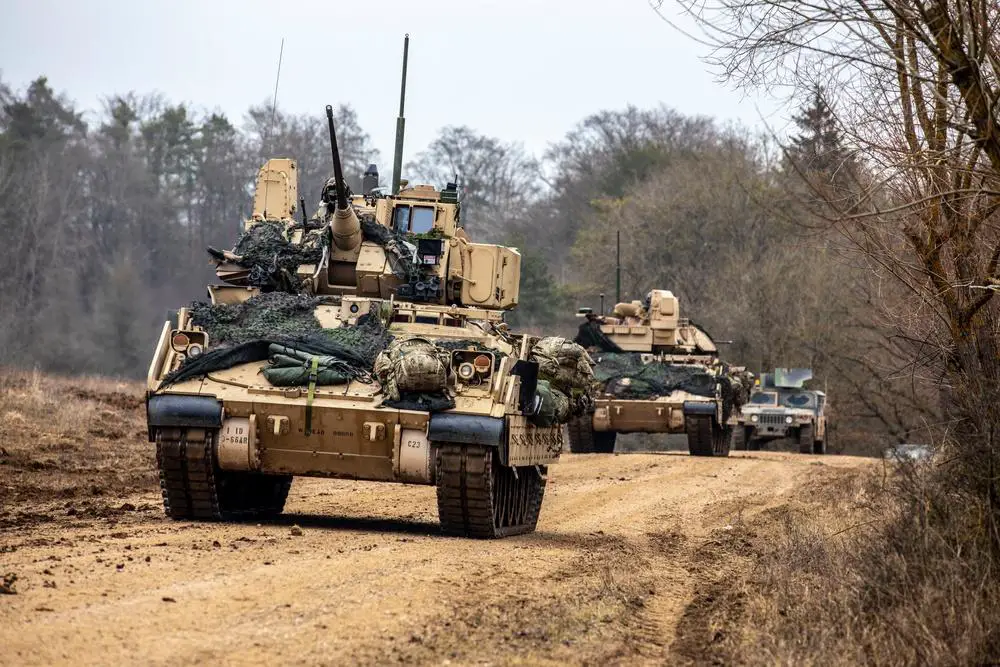 U.S. Soldiers assigned to 3rd Battalion, 66th Armored Regiment, 1st Brigade, 1st Infantry Division maneuver M2 Bradley Fighting Vehicles during exercise Allied Spirit 22 at the Joint Multinational Readiness Center in Hohenfels, Germany, Jan. 27, 2022. 