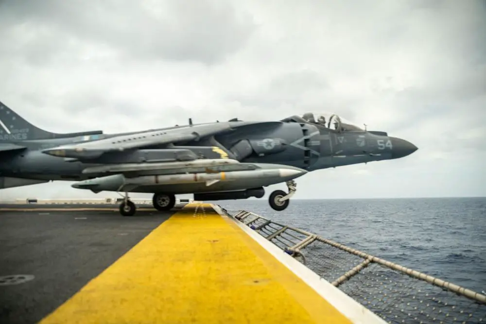  A U.S. Marine Corps AV-8B Harrier attached to Marine Attack Squadron (VMA) 214, 11th Marine Expeditionary Unit (MEU), takes off from the flight deck of Wasp-class amphibious assault ship USS Essex (LHD 2) in support of Exercise Noble Fusion, Feb. 3, 2022.