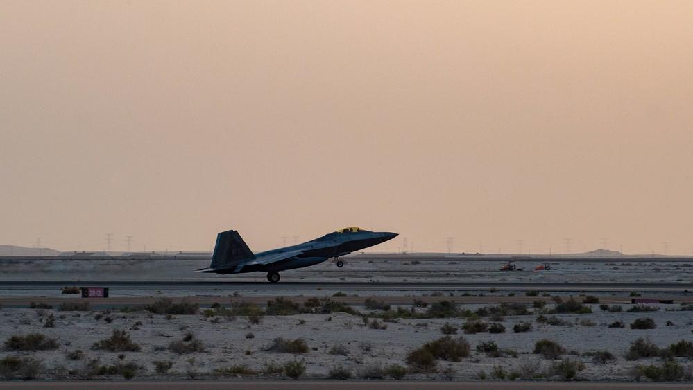 U.S. Air Force F-22 Raptors arrive at Al Dhafra Air Base, United Arab Emirates, Feb. 12, 2022.