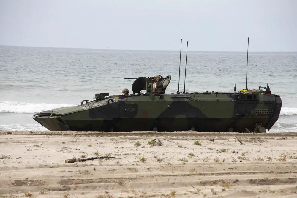 A U.S. Marine Corps amphibious combat vehicle assigned to 1st Platoon, Charlie Company, 3rd Assault Amphibian Battalion, 1st Marine Division, maneuvers across the beach during bilateral amphibious assault training as part of exercise Iron Fist 2022 at White Beach, Marine Corps Base Camp Pendleton